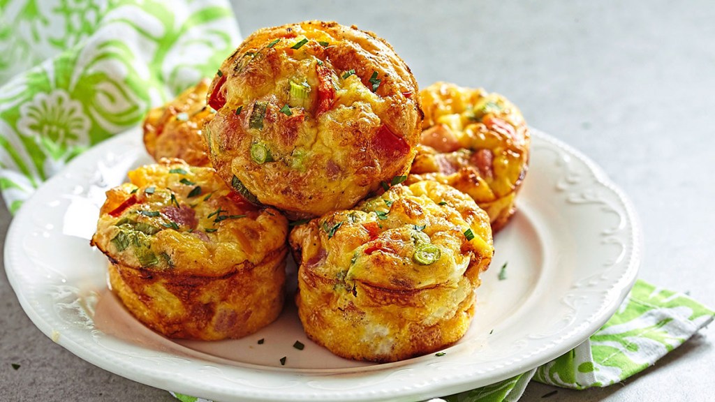 Keto egg muffins with ham, cheese and vegetables