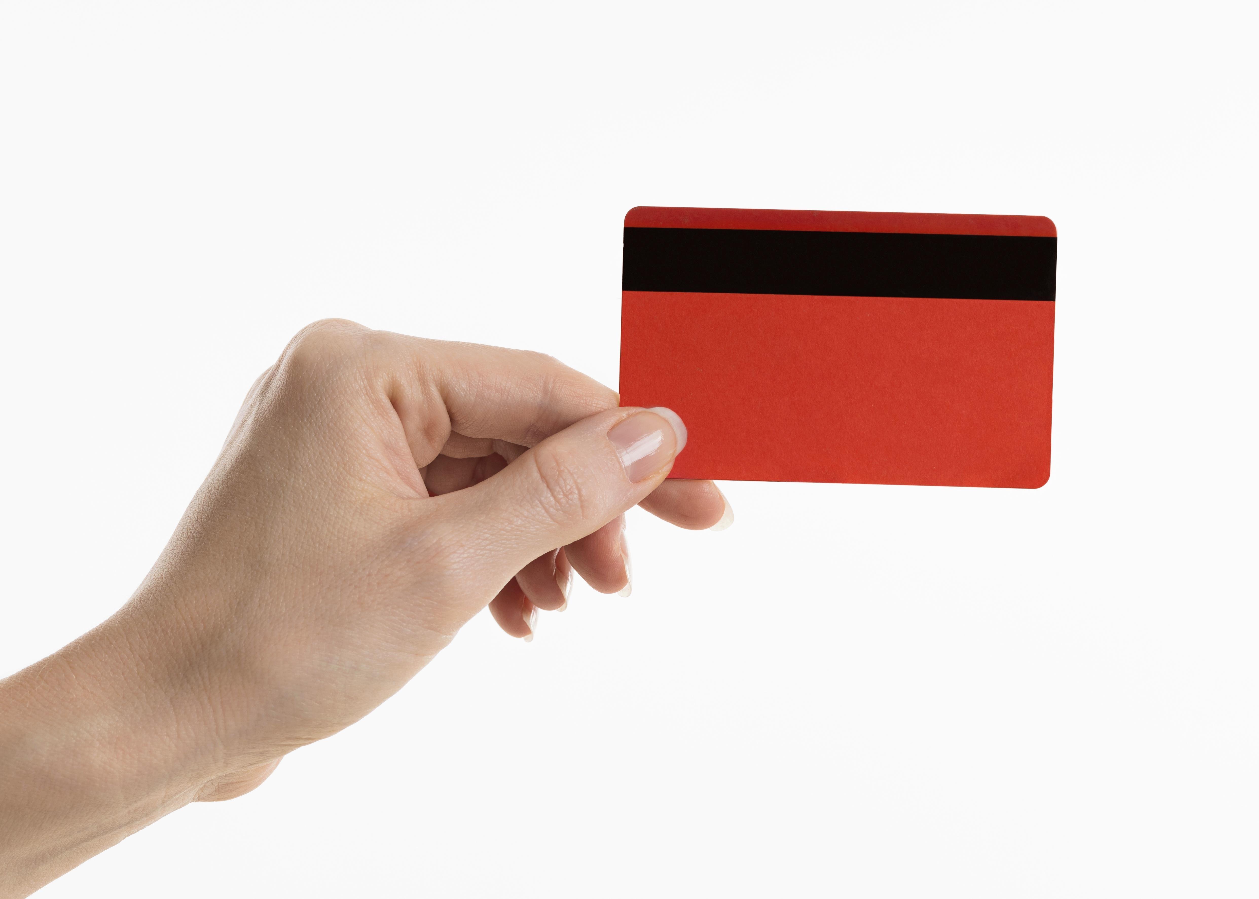 hand holding red credit card