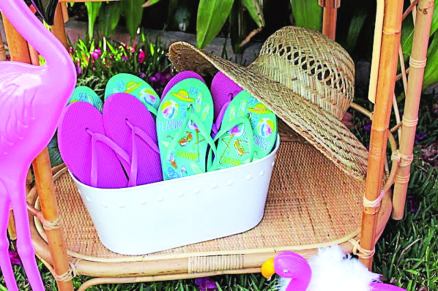 White bin filled with colorful flip flops