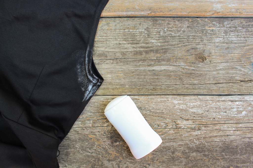 white deodorant stain on black shirt