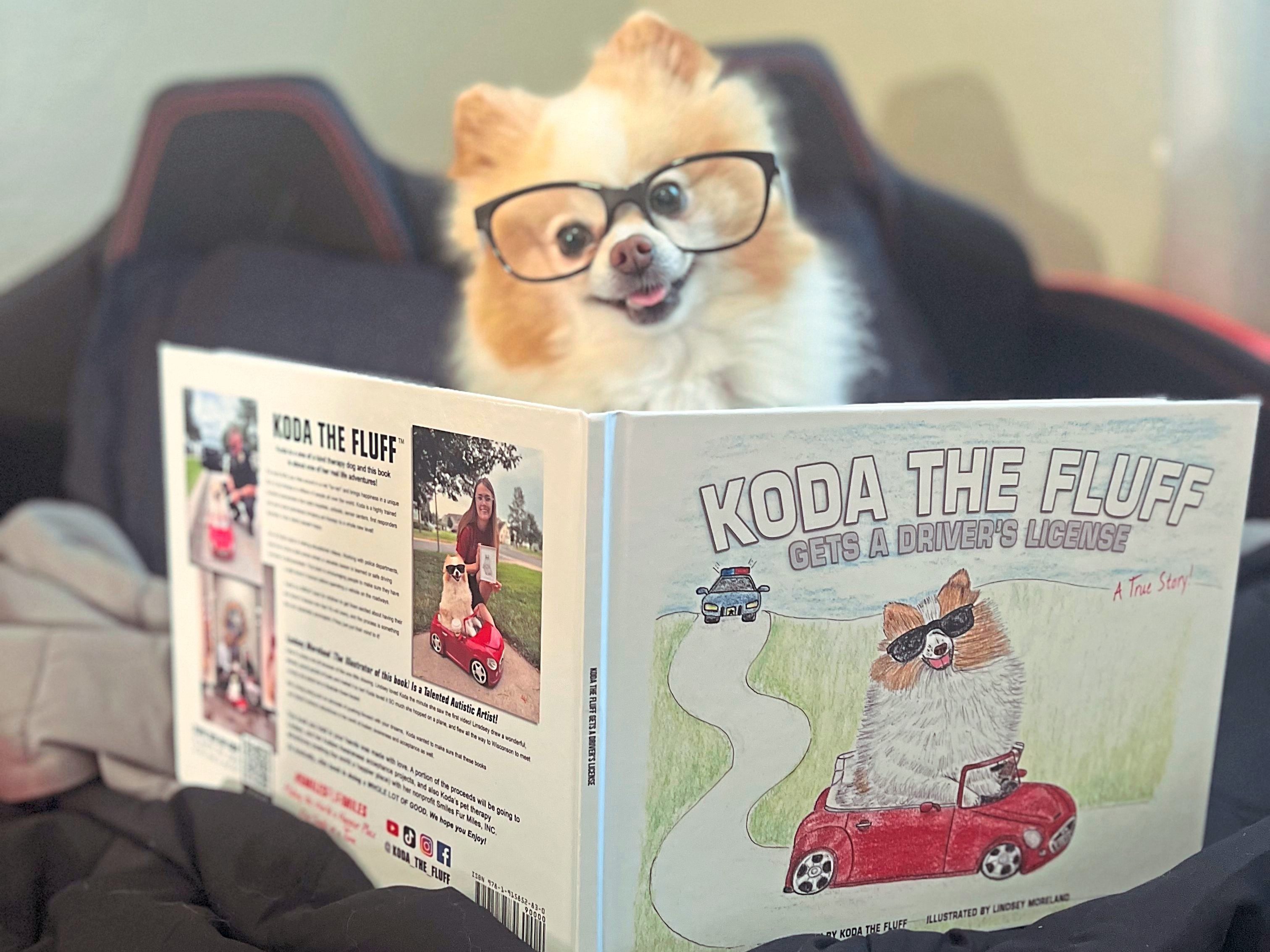 Koda the fluff and her book Animal Heroes