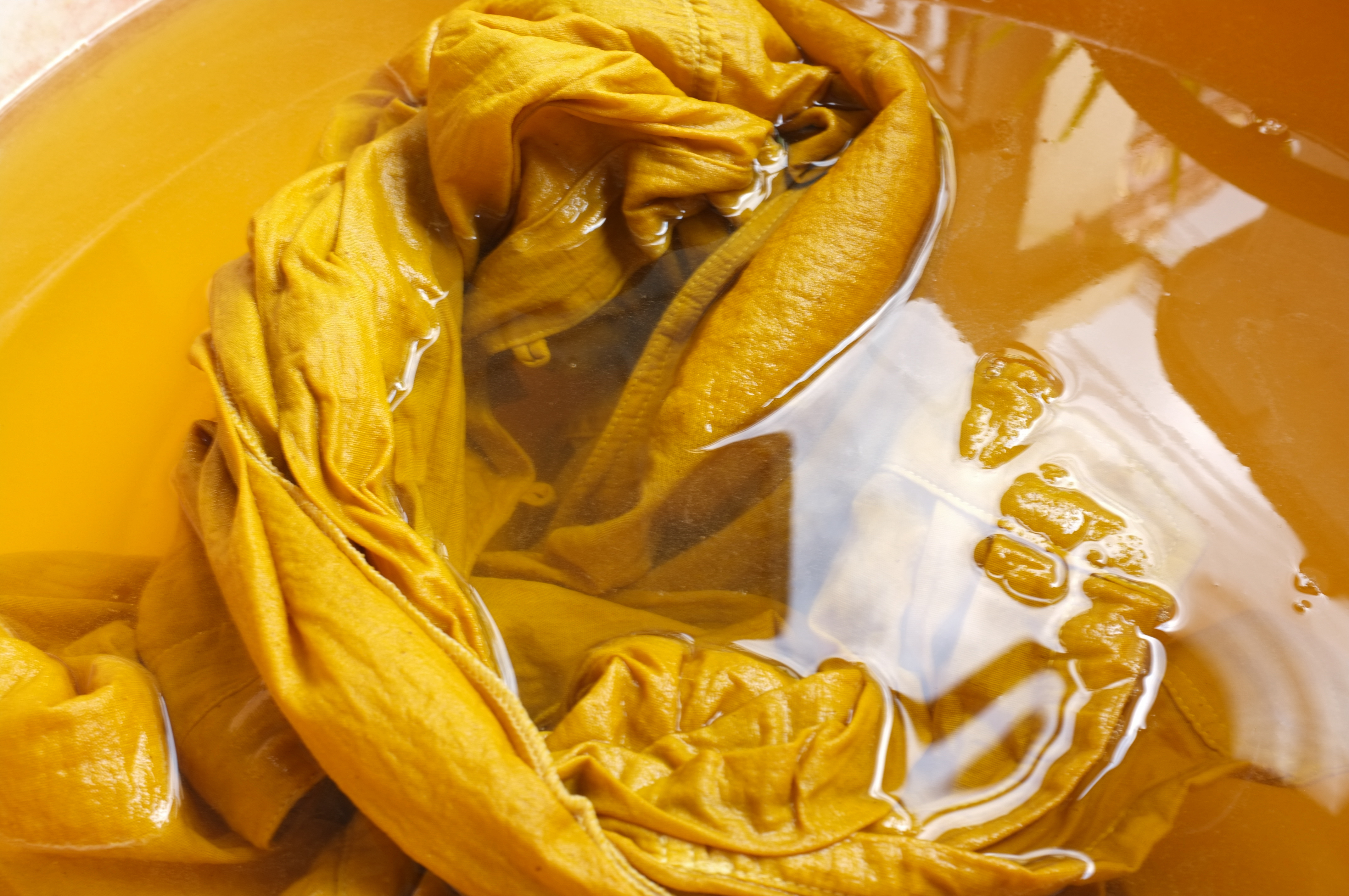 naturally dyed fabric iin water with alum powder