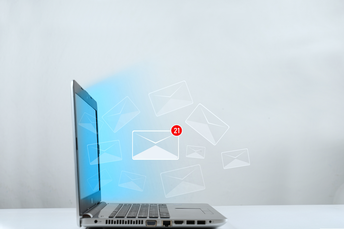 illustration of a laptop receiving an mail  notification