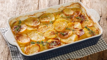 A baking dish of potatoes au gratin made with light cream instead of heavy cream