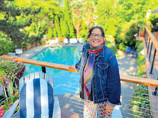 Lisa Schroeder in front of her pool, side hustles for women
