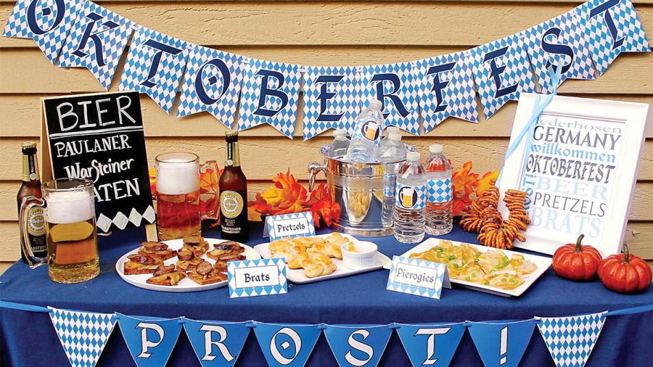 Oktoberfest party ideas: table with German spread of food and drinks