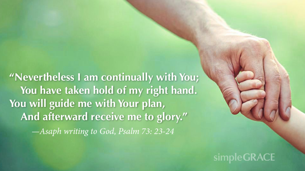 A photo of a father holding a child's hand with the text of Psalm 73