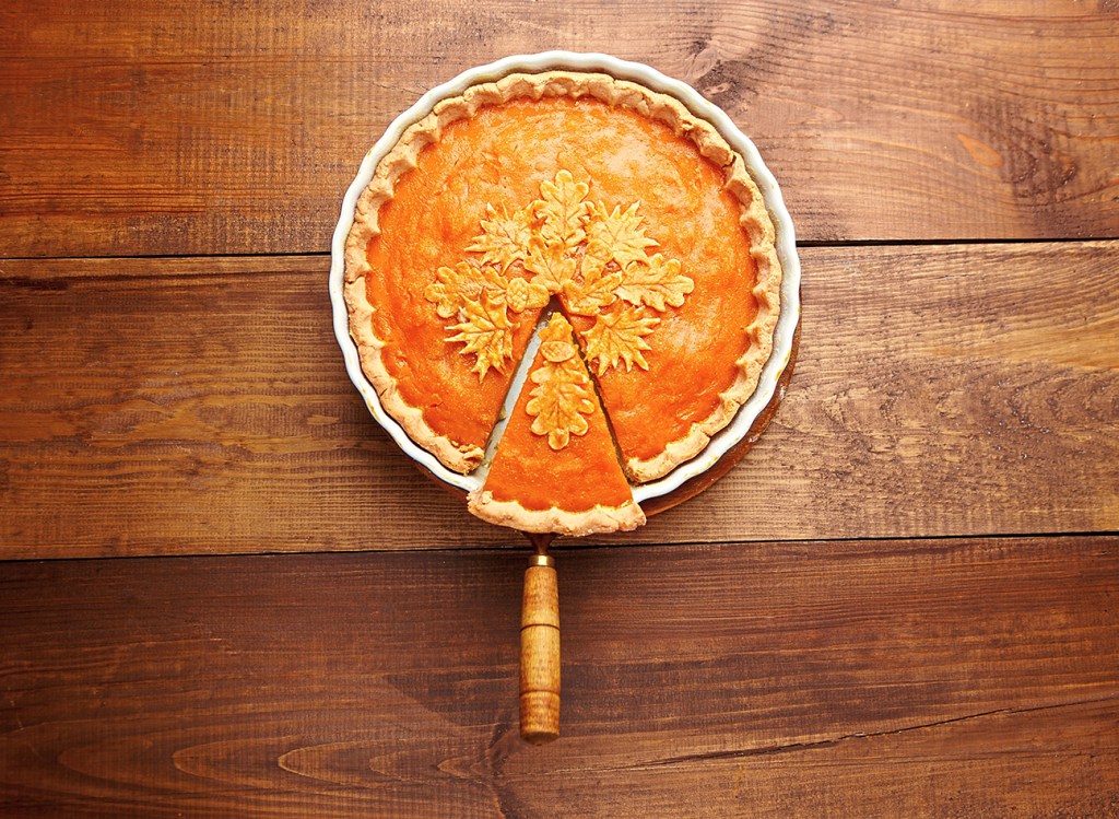 Dessert party: Autumnal pumpkin pie on wooden table