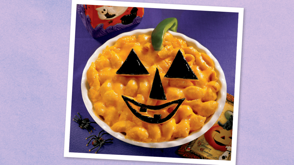 Mac & Cheese Jack-o’-Lantern sits looking like an icon (halloween dinner ideas)