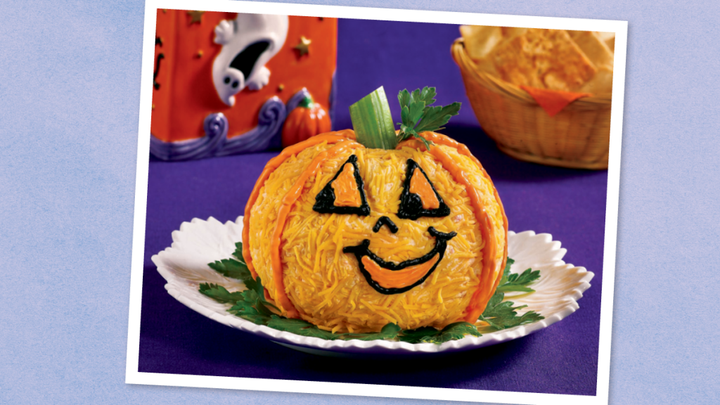 Pumpkin Cheese Ball sits looking cute (Halloween dinner ideas)