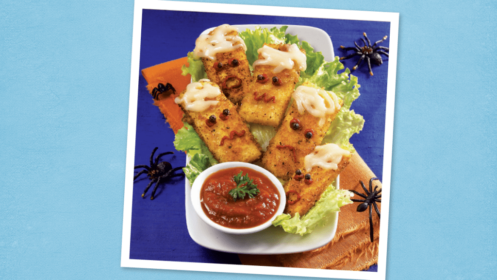 Cheesy Zombie Dippers sits on a blue background (Halloween dinner ideas)