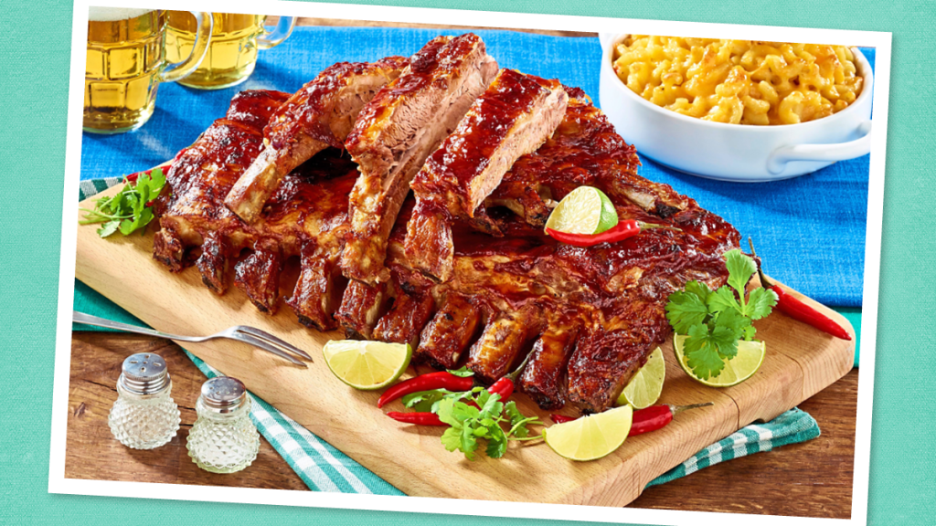 Slow-Cooker BBQ Spareribs sits on a wooden board ( Game day slow cooker recipes)