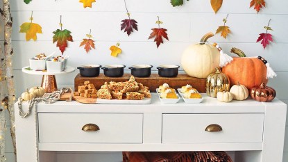 Dessert party: LEAD FALL DESSERT PARTY TABLE shows mix of desserts and treats on table with leafy fall backdrop