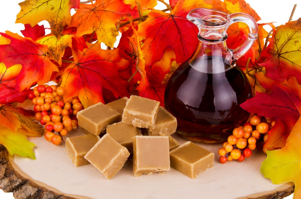 Dessert party: Fall vignette that shows a wooden tray displaying maple fudge and a jar of maple syrup