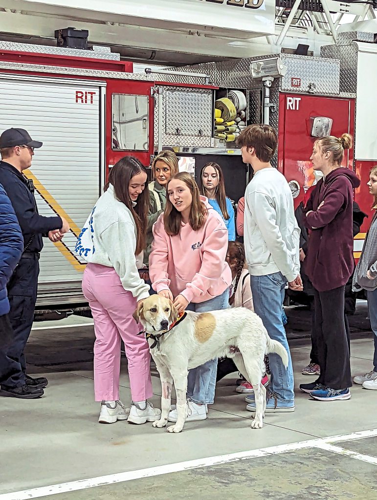 Brookfield Central High School's PAWS group visiting Koda at the fire department