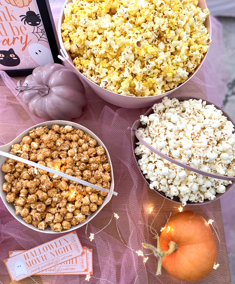 Halloween movie night: Pails of different flavored popcorn for guests to enjoy