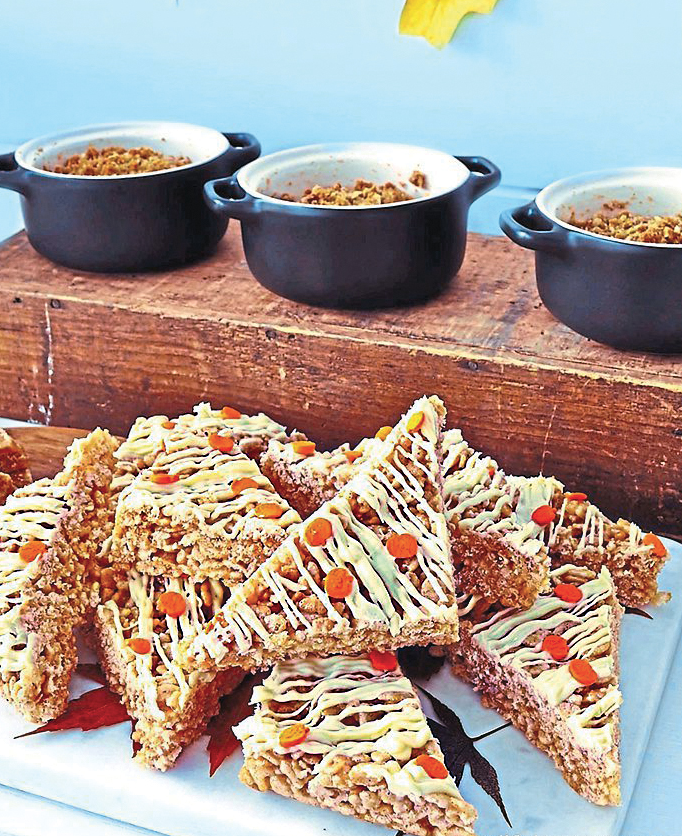 Dessert party: Mini bite-sized treats including apple crisp crocks and pumpkin rice crispy treats on servers