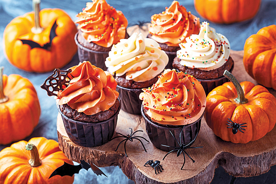 Adult Halloween Party: Halloween Cupcakes with white and orange icing on wooden tray