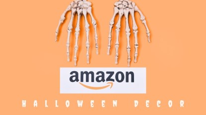 A Canva image with an orange background and two skeleton hands with the Amazon logo that reads 'Halloween Decor.'
