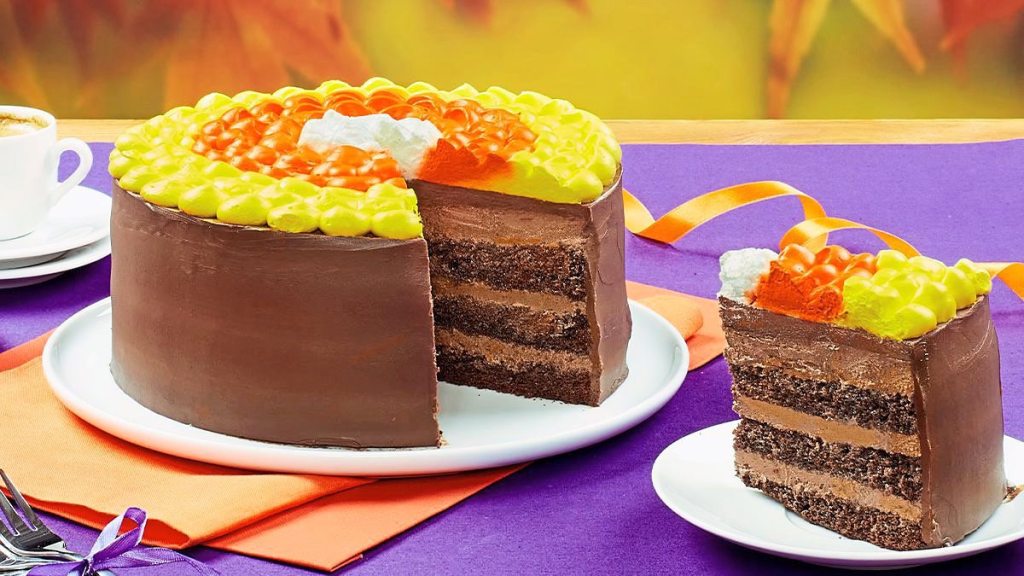 Candy Corn Chocolate Layer Cake sits on a white plate