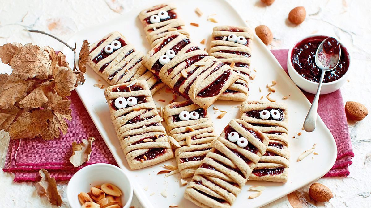 Halloween Cupcakes: Mummy Linzer Cookies sits looking spooky