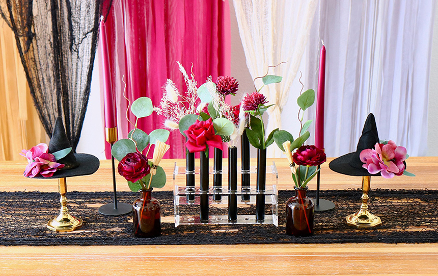 DIY Bouquet: Test Tube Halloween Centerpiece Idea that shows blooms styled in test tubes on Halloween table