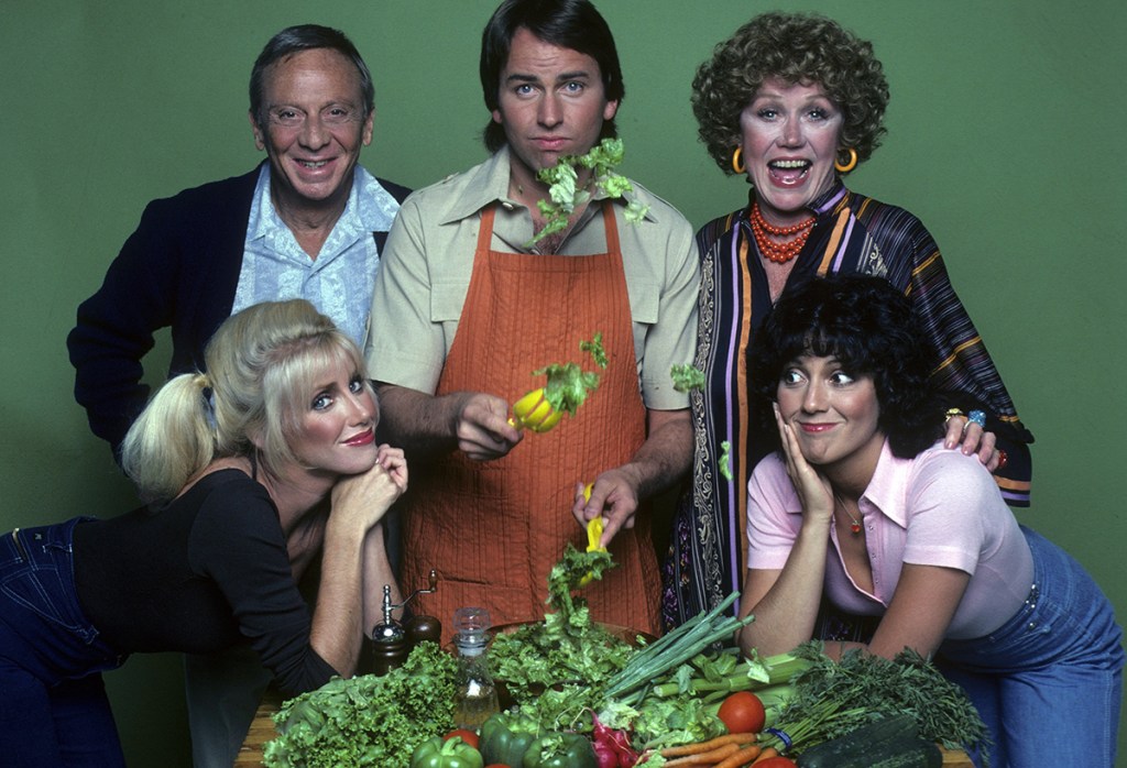 The cast of Three's Company from its earliest days, including Norman Fell and Audra Lindley as Mr. and Mrs. Roper