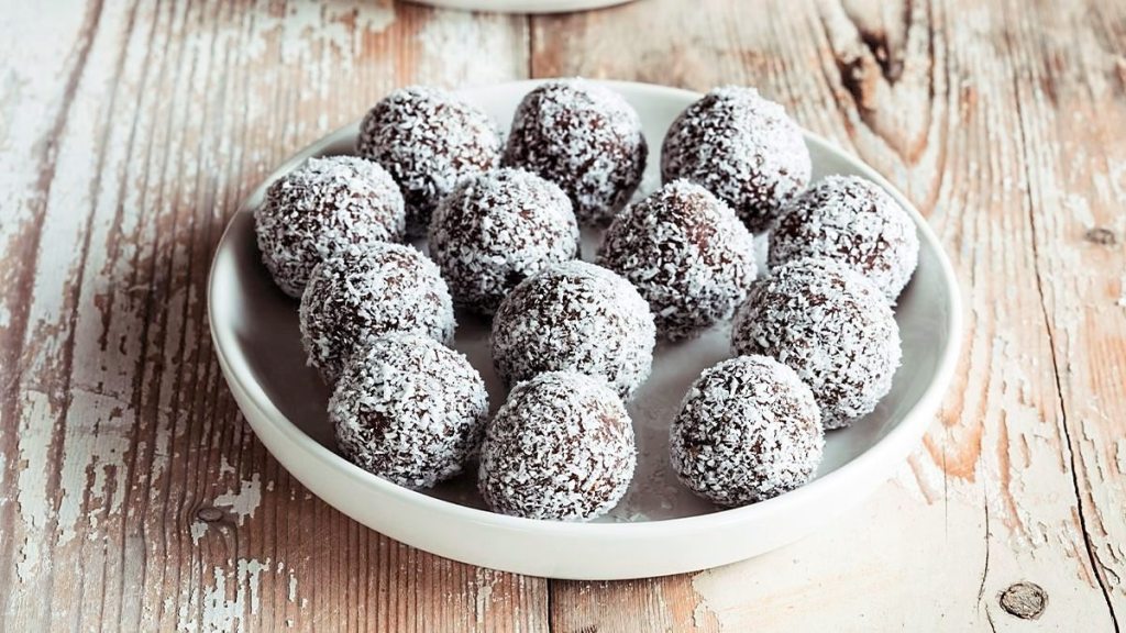 Chocolate-Coconut Truffles sits on a white plate (5-minute desserts)