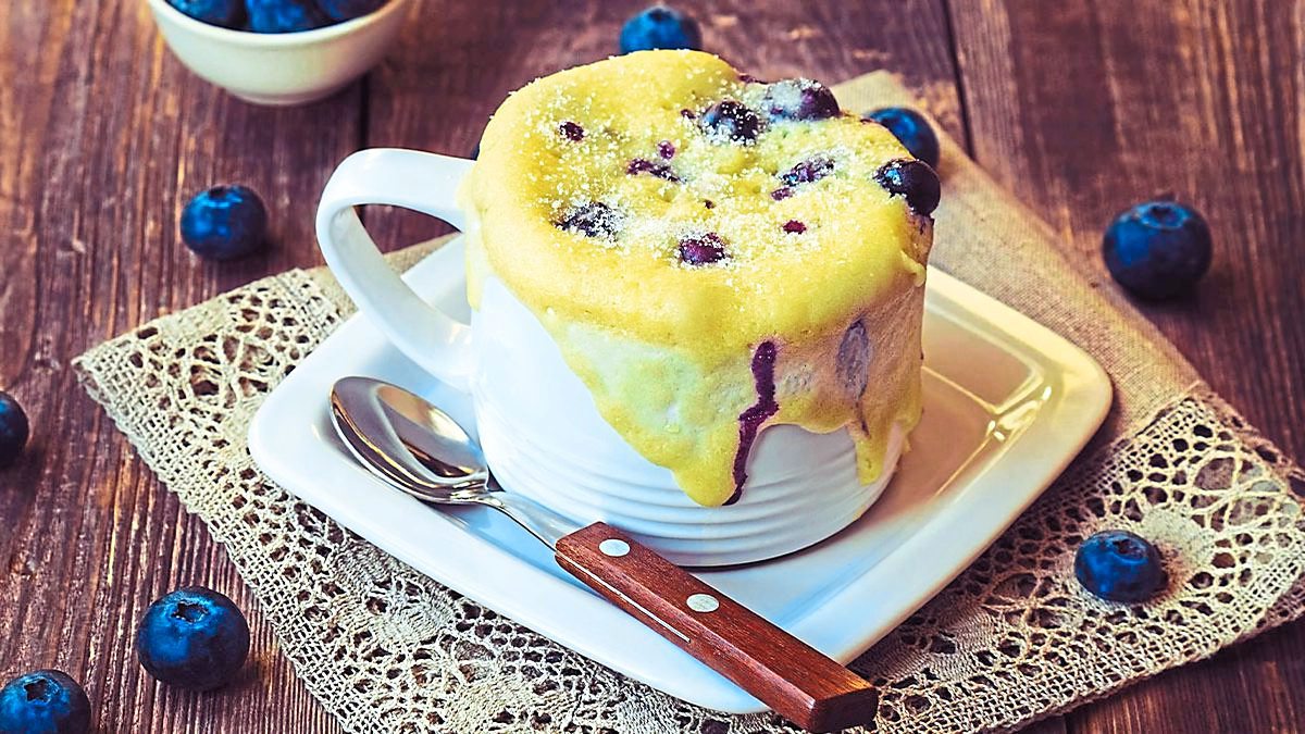 Blueberry Lemon Mug Cake sits in a white mug (five minute desserts)