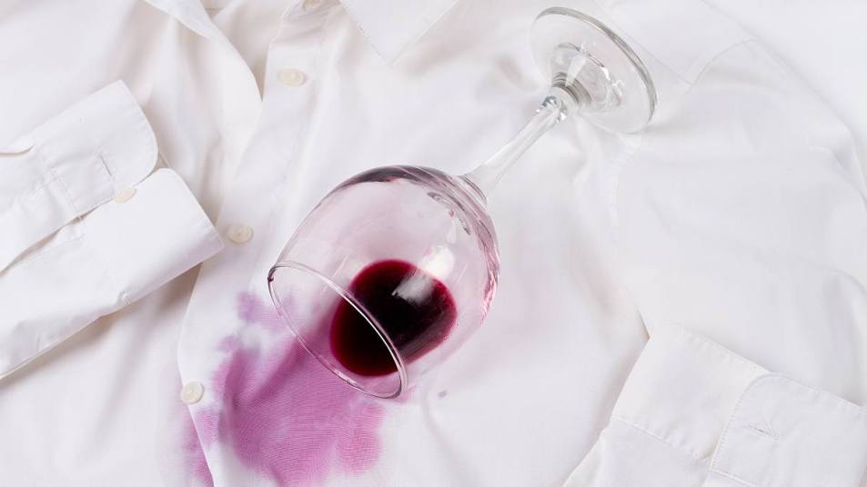 How to get wine stains out: Wine glass, spilled, on a white shirt, no people, horizontal, concept, top view