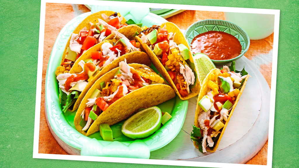Grilled Chicken & Corn Tacos sits on a green background (taco tuesday recipes)