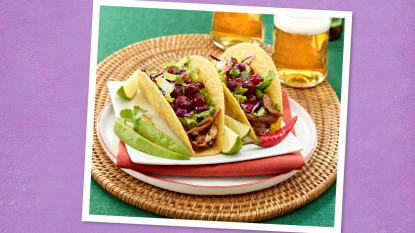 Zesty Southwest Turkey Tacos sits on a purple background (taco tuesday recipes)