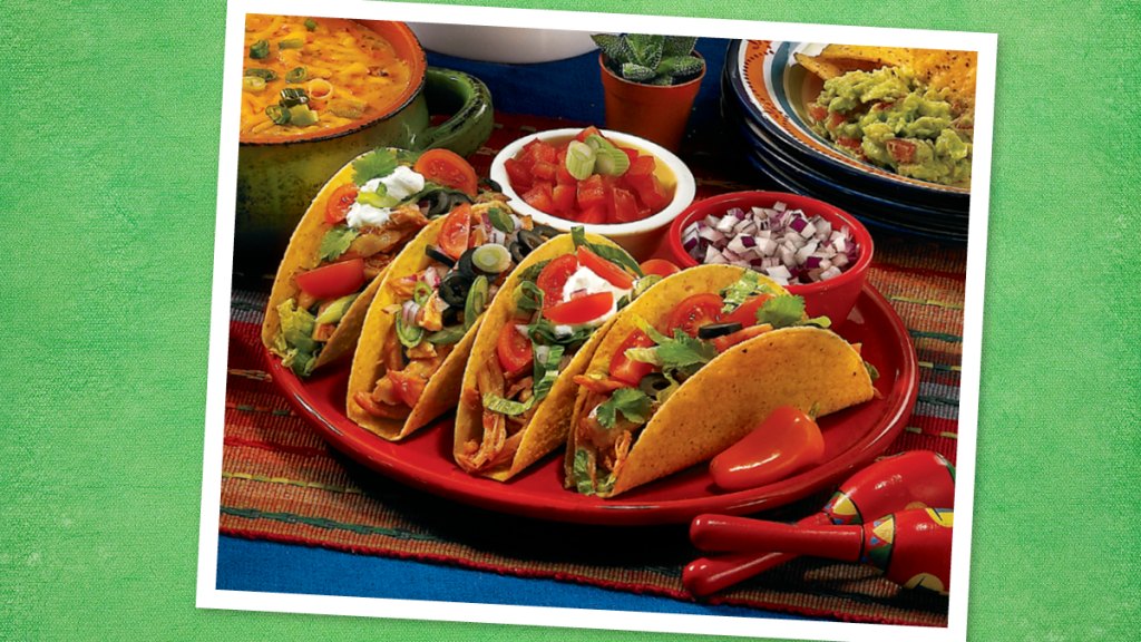 Barbecued Chicken Tacos sits on a green background (taco tuesday recipes)