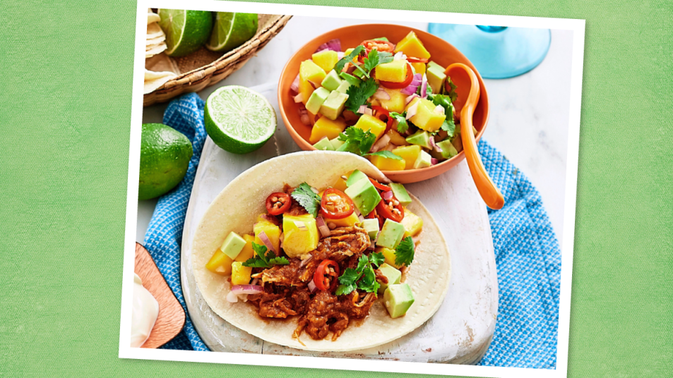 BBQ Chicken Tacos with Mango Salsa sits on a green background (taco tuesday recipes)