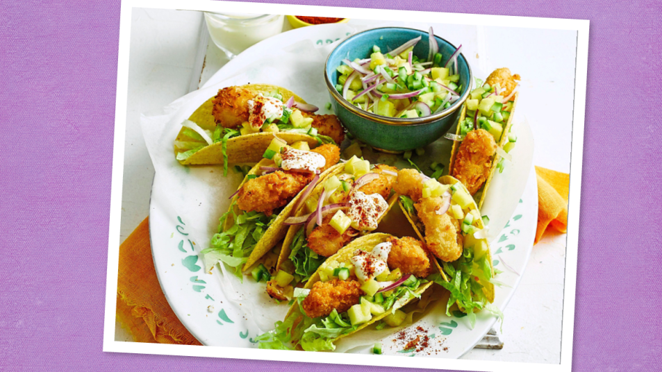Air-Fryer Fish Tacos sits on a purple background (taco tuesday recipes)