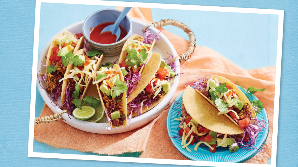 Chili Beef Tacos sits on a blue background (taco tuesday recipes)