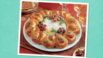 Cranberry Walnut Bread Wreath sits on a teal background (Thanksgiving appetizers)
