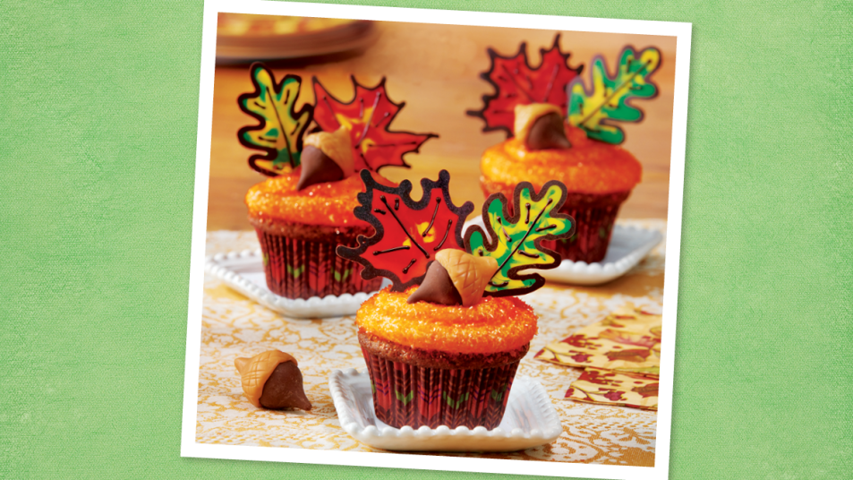Fall Leaves Cupcakes sits on a green background (Thanksgiving cupcakes)