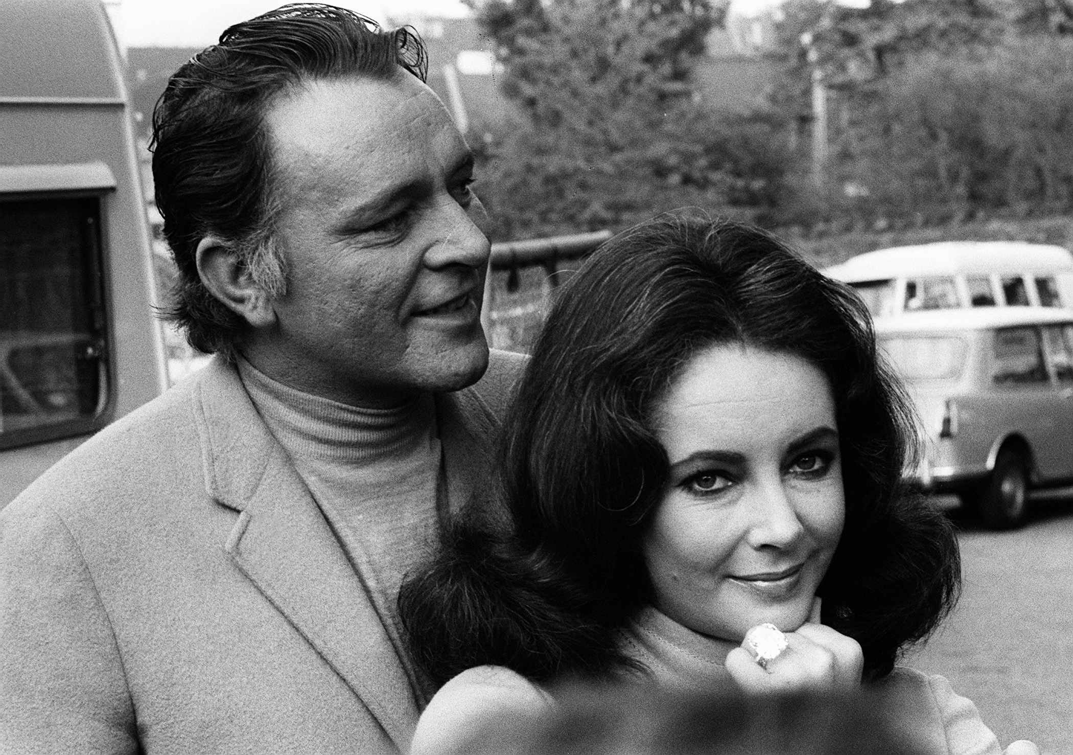 Elizabeth Taylor with Richard Burton showing off her diamond ring (1968)