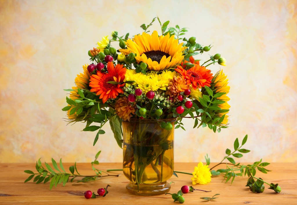 What to do with Thanksgiving leftovers: Revive a holiday bouquet with a festive floral mix; colorful flowers in clear vase