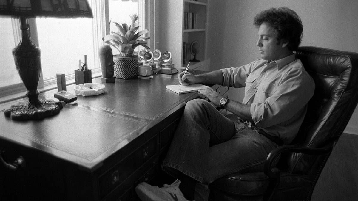 Billy Joel writing in his Los Angeles home, 1984 Moonlighting cast