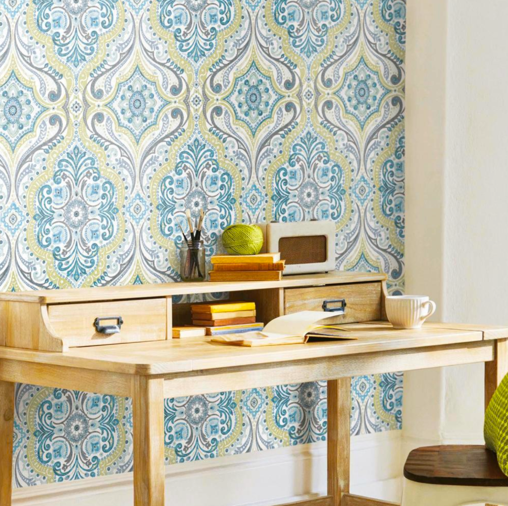 Stick-on wallpaper: Home office with blue and green damask stick-on wallpaper behind desk