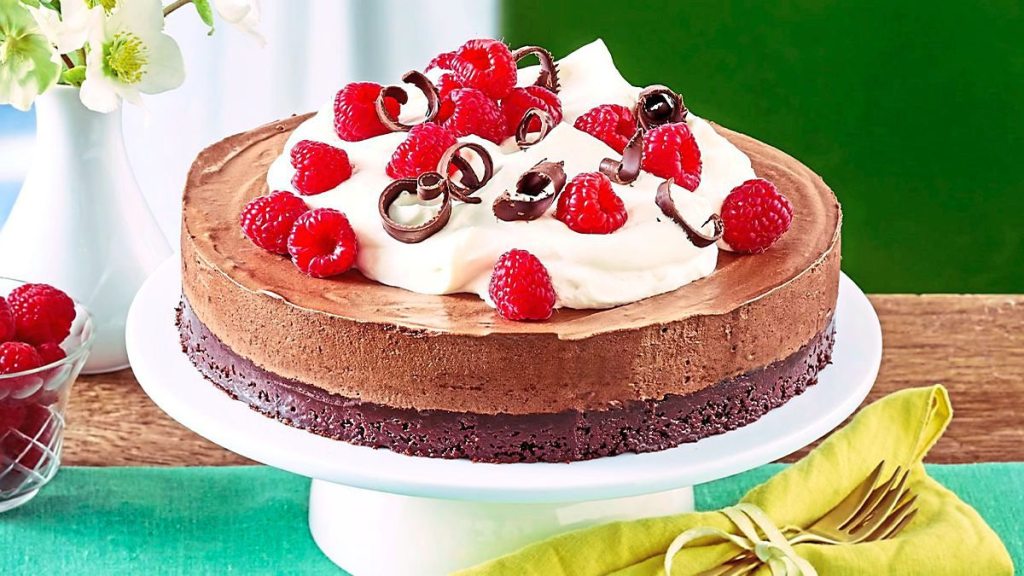 Sky-High Malted Chocolate Mousse Cake sits on a stand (Easy desserts with few ingredients)