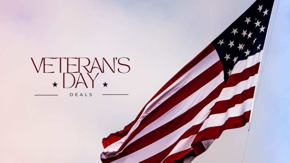 An image of the American flag waving in the breeze with a cotton candy sky background and text reading 'Veteran's Dale Deals.'