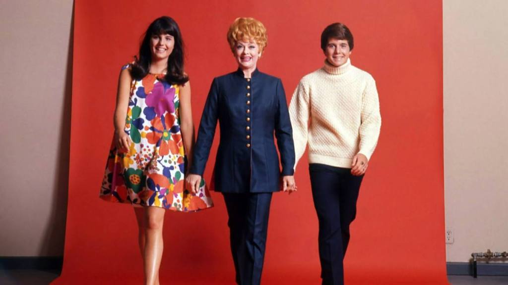 Lucie Arnaz, Lucille Ball and Desi Arnaz Jr. walking hand in hand on ‘Here’s Lucy’