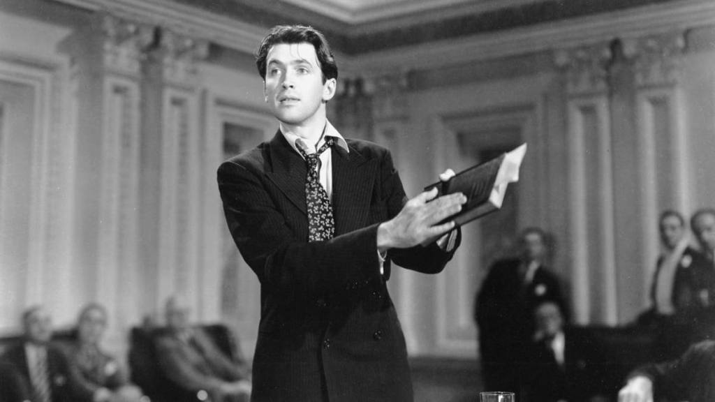 Man holding a book in “Mr. Smith Goes to Washington”