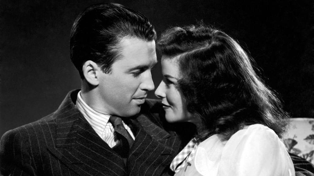 Jimmy Stewart and Katharine Hepburn looking at each other in “The Philadelphia Story”