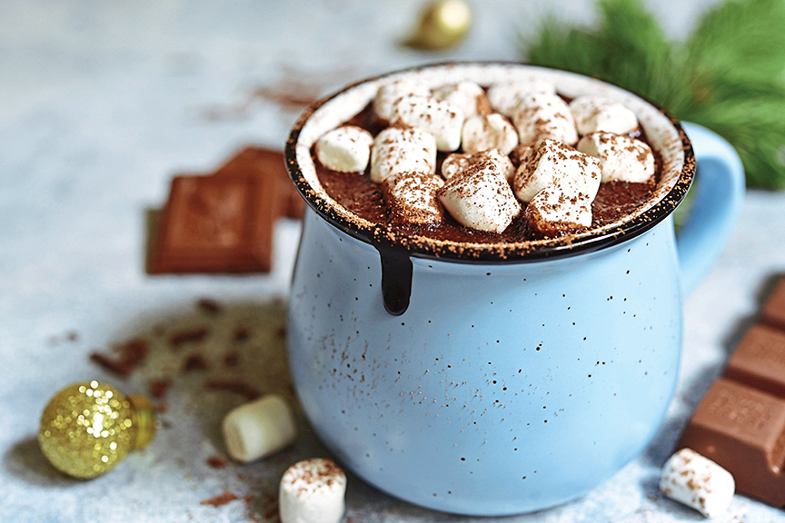 Hot chocolate bar: Easy serving trick for hot cocoa image shows a mug of cocoa with marshmallows in a blue mug
