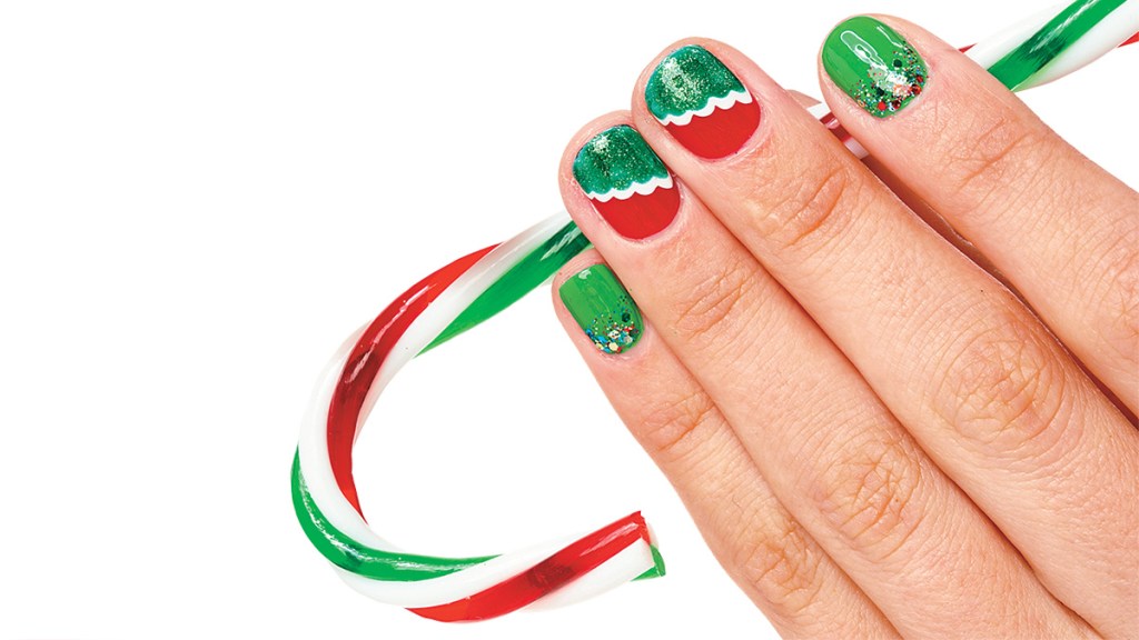Nails painted green and red with sparkly polish and tiered accent nails, one holiday nails idea