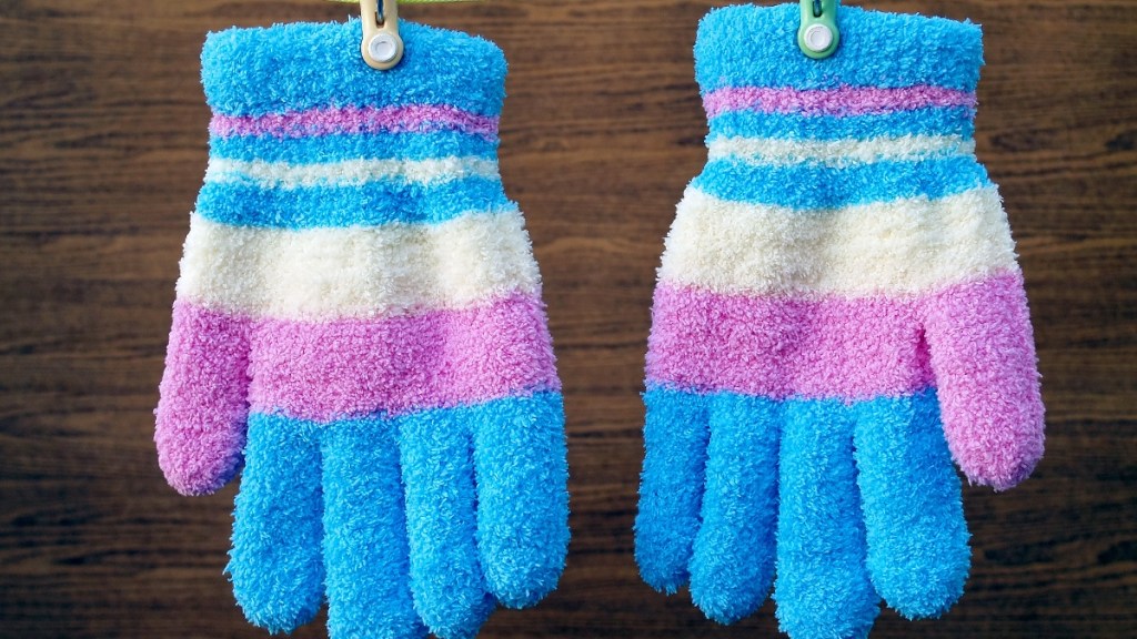 Pair of gloves with chip clips or plastic clothespins attached to them